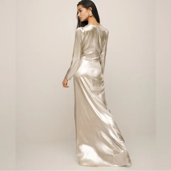 This is a Reformation Gatsby Dress in a silver or champagne color new with tags